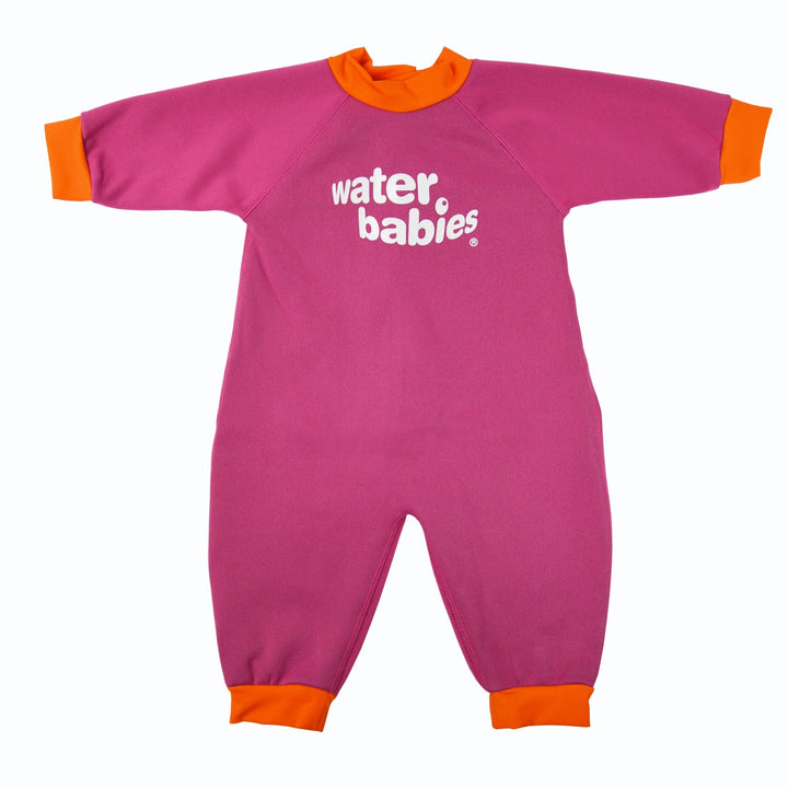 Warm baby wetsuit in pink with orange collar and cuffs